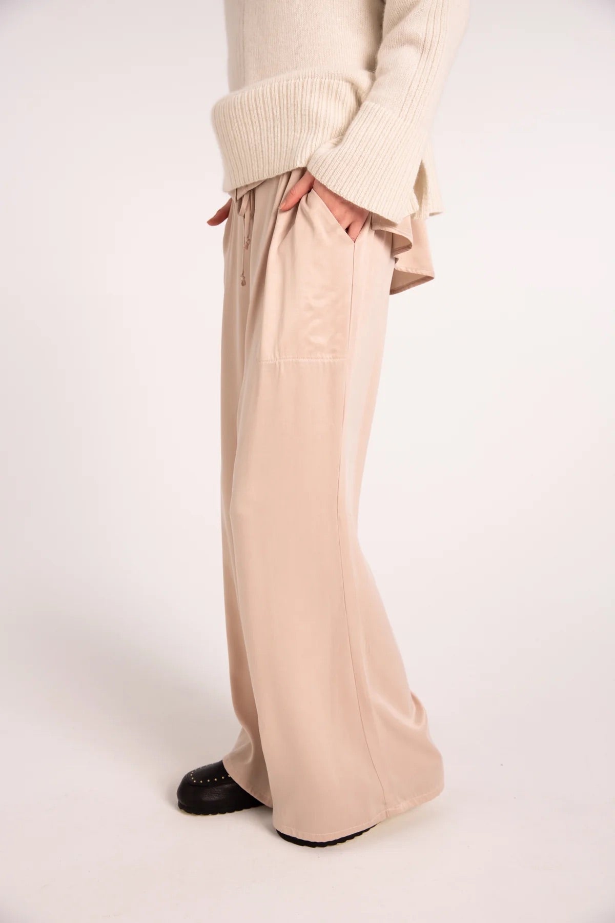 The Nyne Awakening Pant from Outline Clothing features here in an elegant sand washed oyster satin.