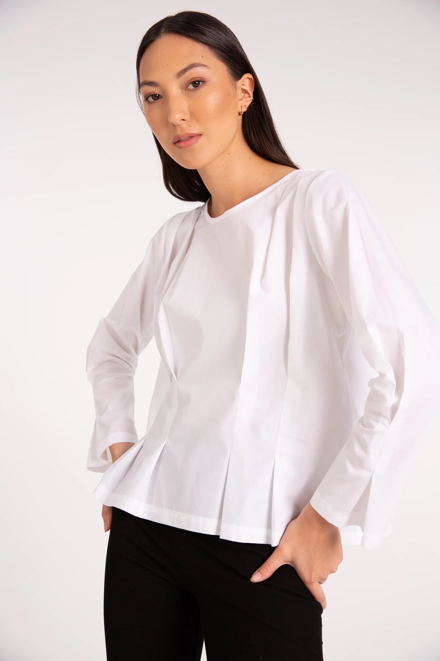 Outline Clothing loves the attention to detail in the Muse Top from Nyne. The Muse Top is a timeless style for every occasion and season. Here in classic black cotton, it features knife pleat details on the shoulders and waist. 