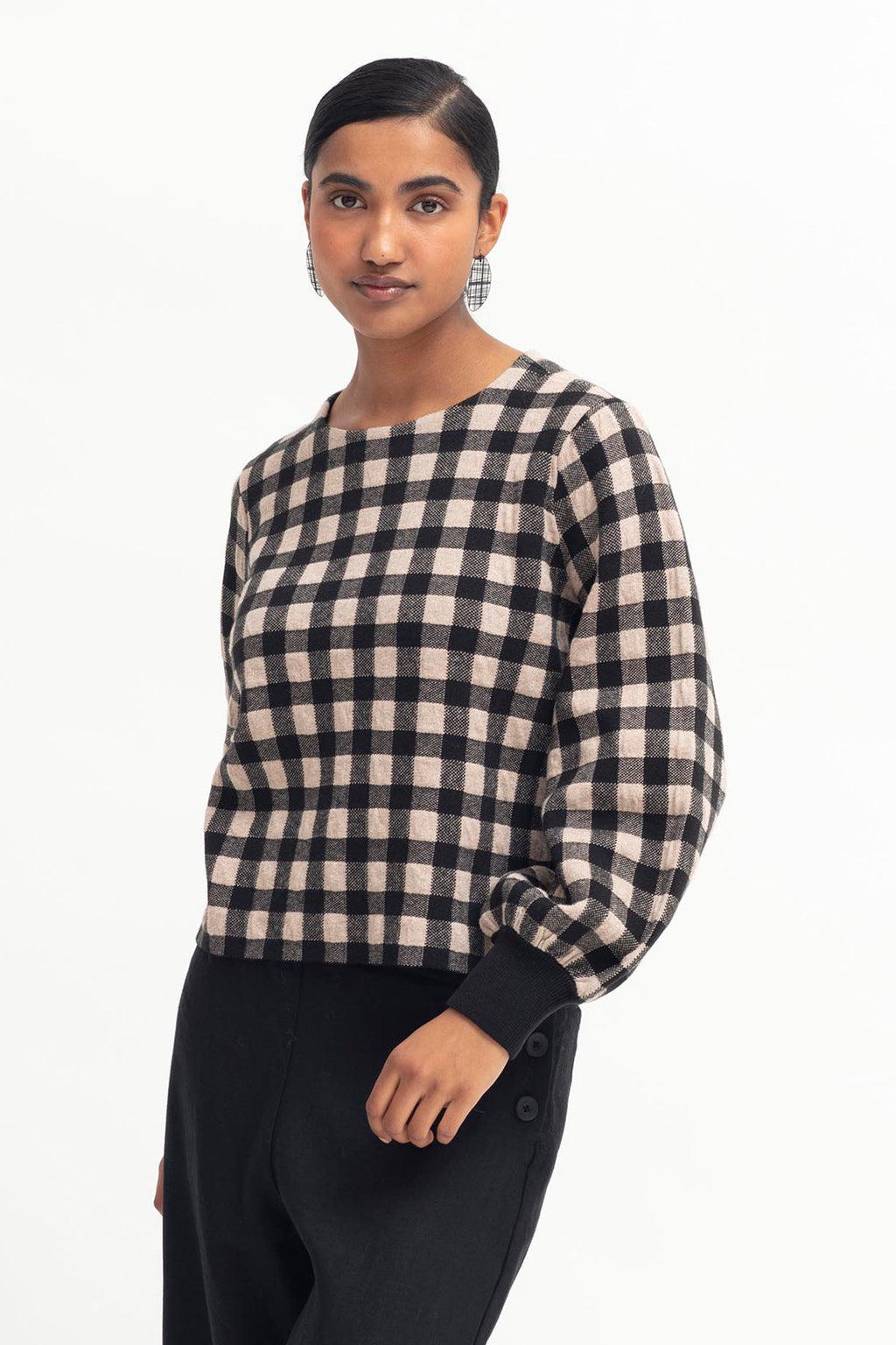Gentle gingham at Outline Clothing  The Karo Sweater features a statement two-tone textured gingham design on a slightly cropped length. With a clean, round neck and a gently dropped shoulder, the puff sleeve gathers to a ribbed cuff.