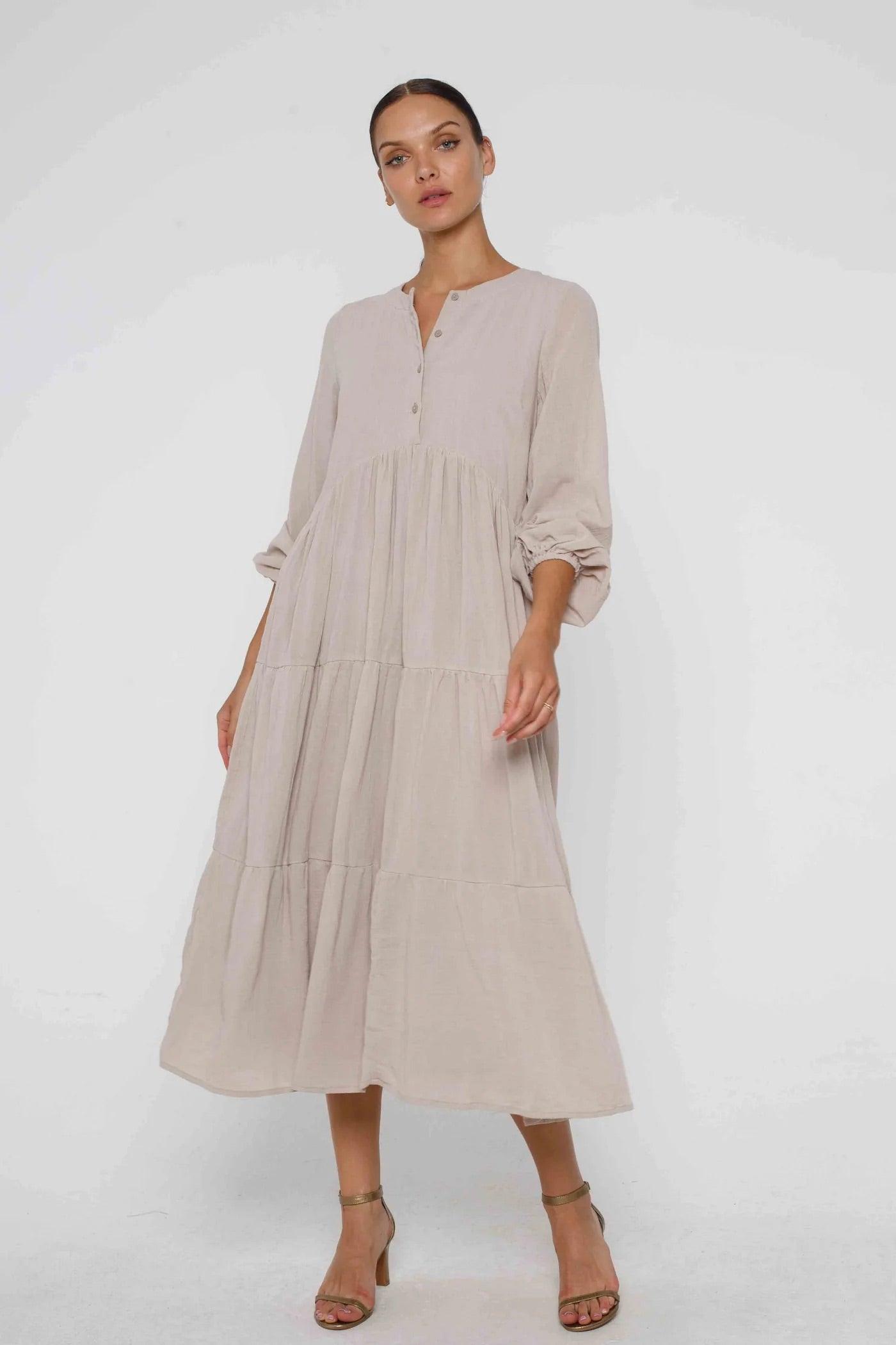Outline Clothing just adores The Harlow Dress from BLAK LUXE. Its such a stunning design and colour for this season.  This long sleeve cotton tiered midi dress is a BLAK fan favourite - the silhouette is so feminine and easy to wear, with a buttoned bodice to wear it your way. 