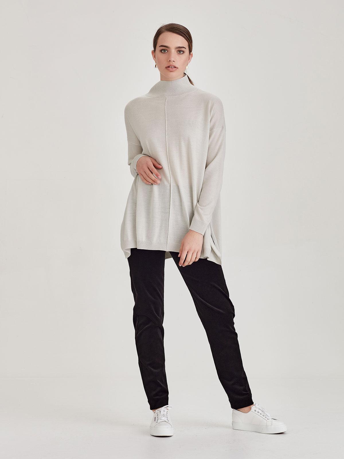 Relaxed fit merino cream top with black pants